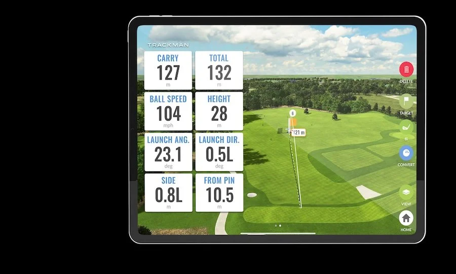 TrackMan golf simulator data showing ball speed, carry distance, and launch angle for indoor golf training