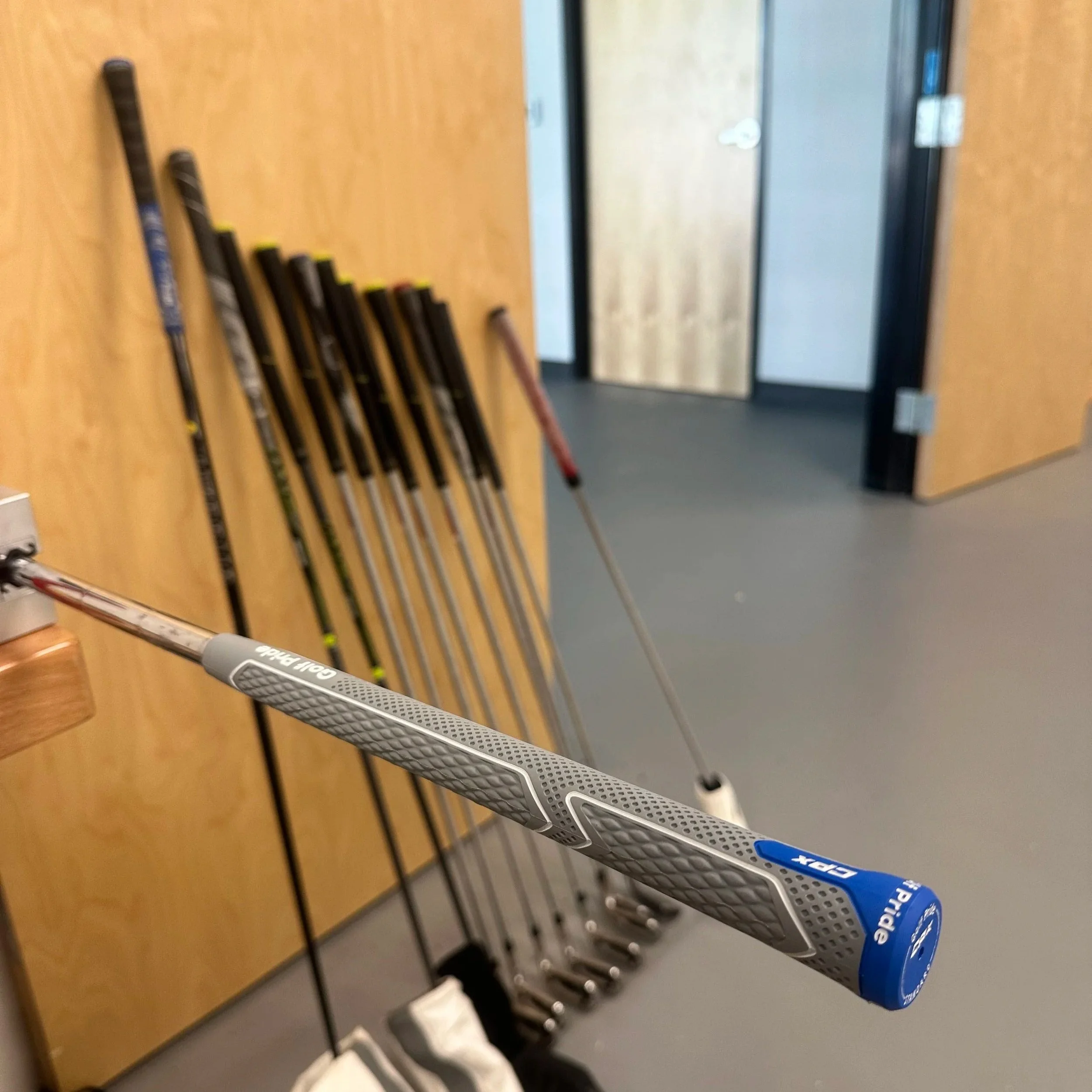 Golf clubs being repaired at Southside Golf Co, offering professional golf club repair services in South Austin, Texas.