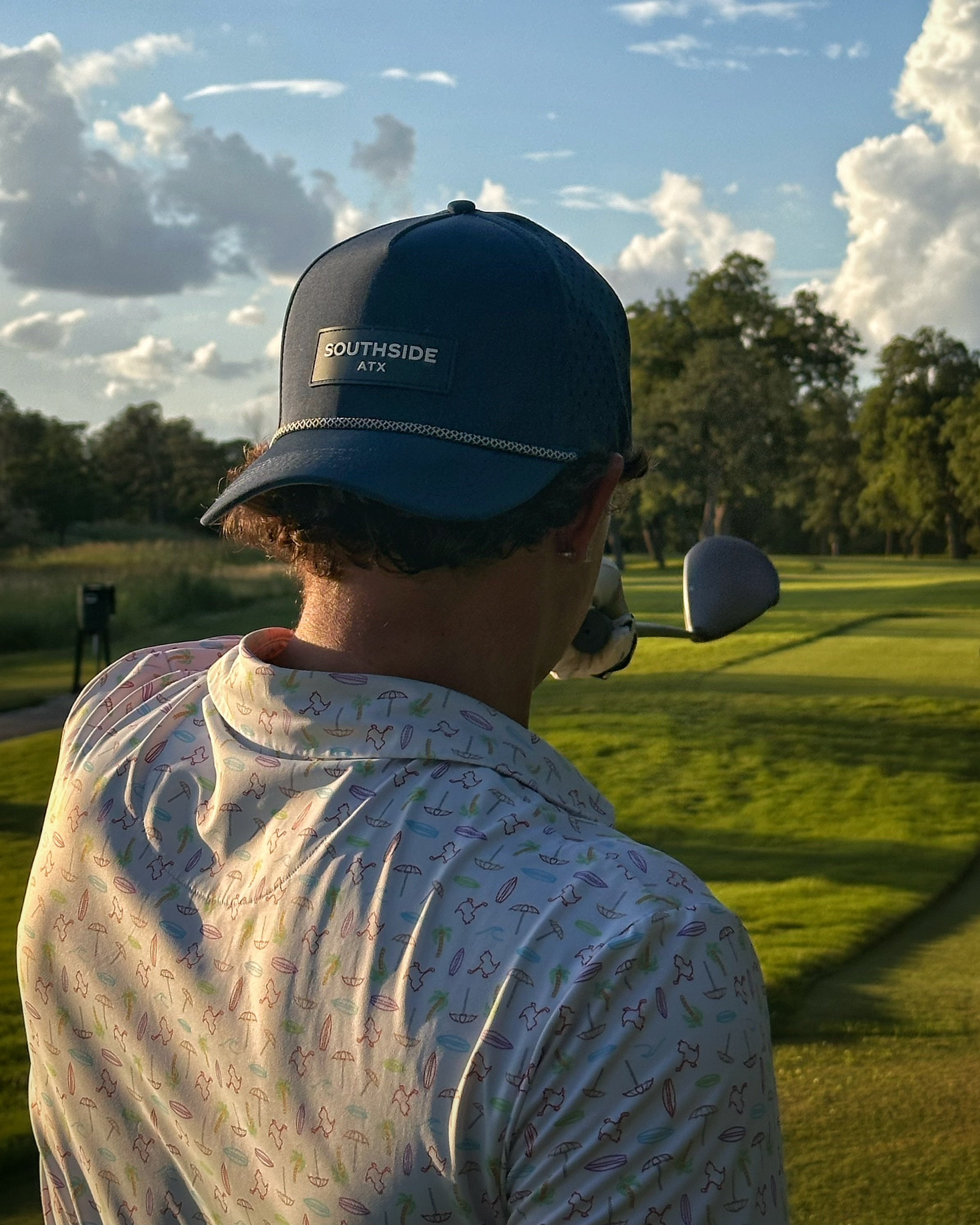Midnight Navy Southside rope golf hat worn on a golf course in Austin