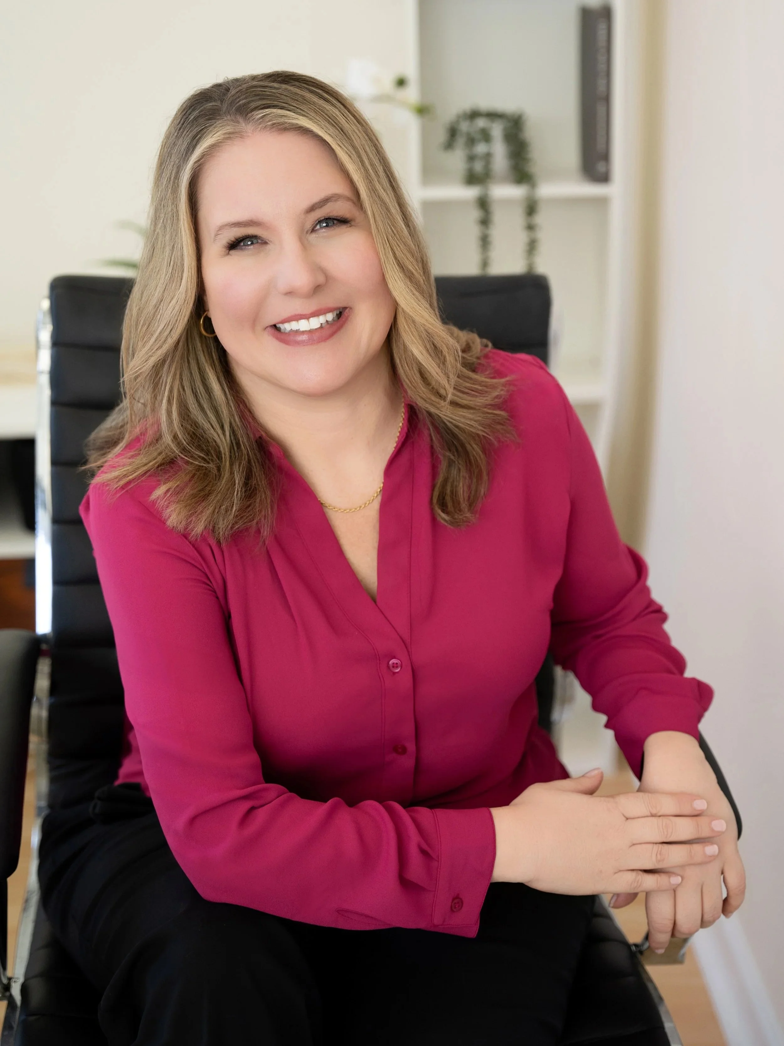 Erica Palmiero, PMHNP, smiling in her office, provider of women’s mental health care at Solara Mental Health for Women.