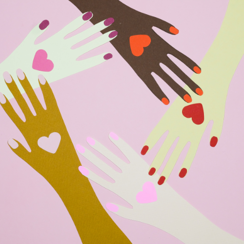 Four stylized hands of different skin tones with hearts on palms and fingertips forming a circle against a pink background.