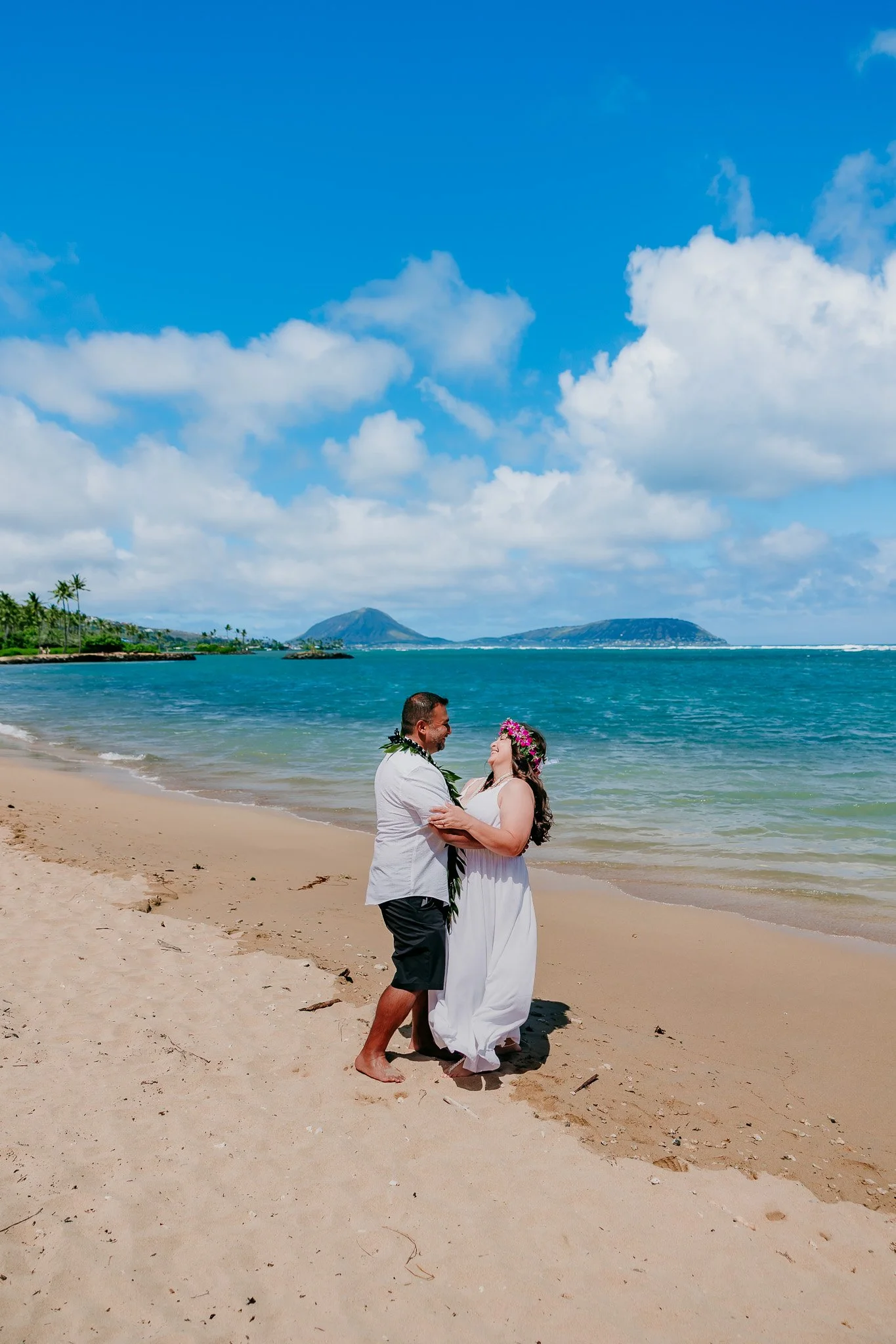 bride and groom dancing on the beach in Oahu Hawaii destination wedding photographer.