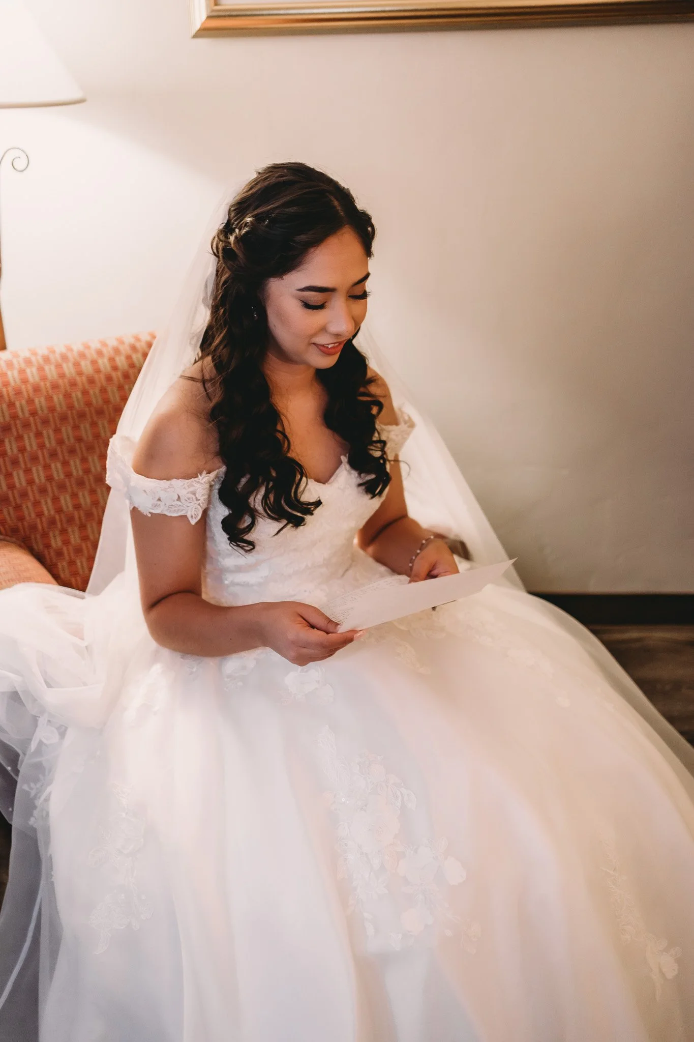Bride reading a private note from groom before ceremony