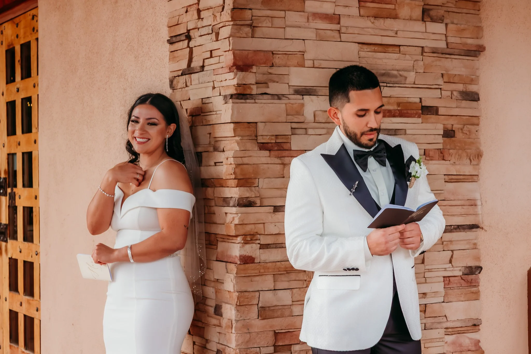 Bride and groom sharing private vows before ceremony