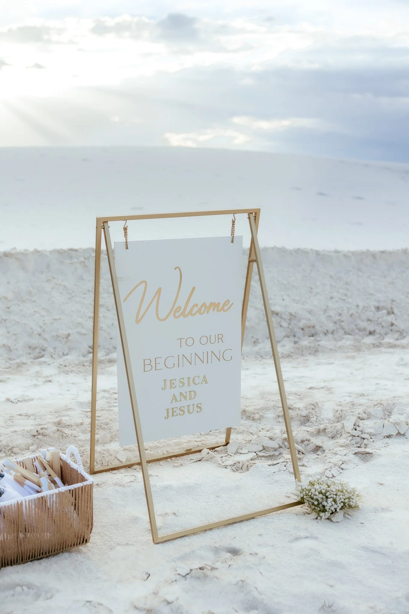 Personalized "Welcome to our beginning" sign displayed during an intimate White Sands National Park elopement in New Mexico.