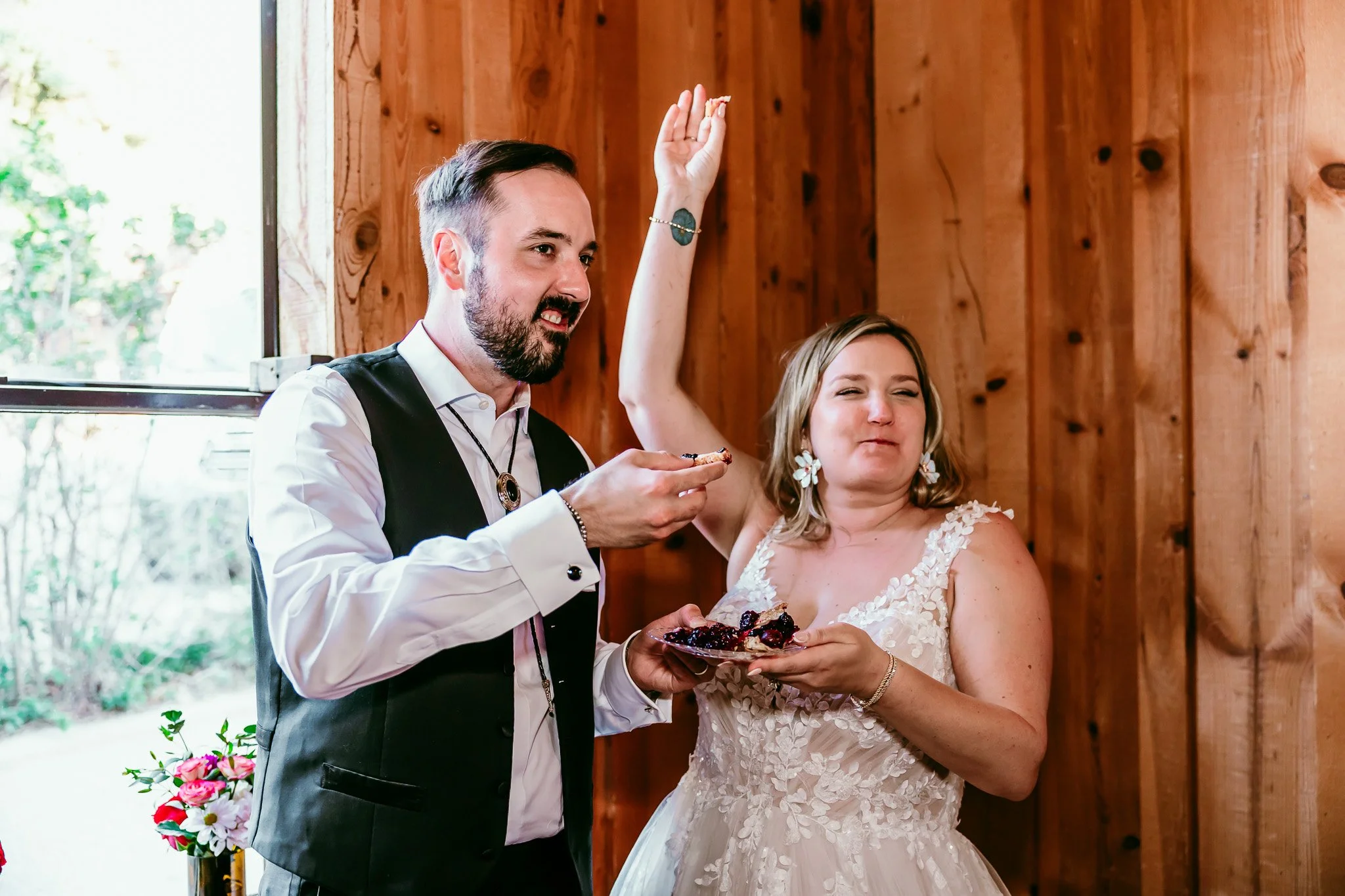 Newly married couple enjoying pie together during their wedding reception at The Lodge Resort in Cloudcroft, New Mexico.