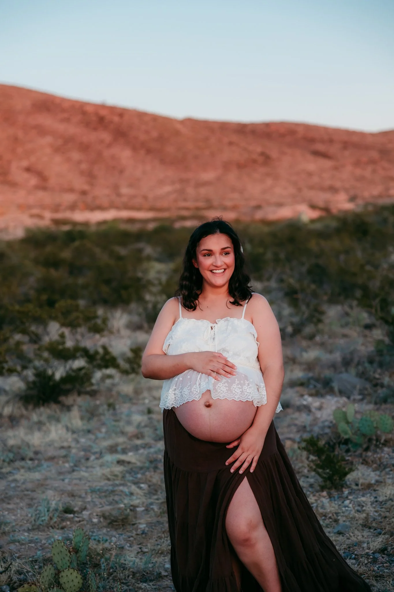 Outdoor maternity portrait of an expecting mother captured by an El Paso maternity photographer during golden hour.