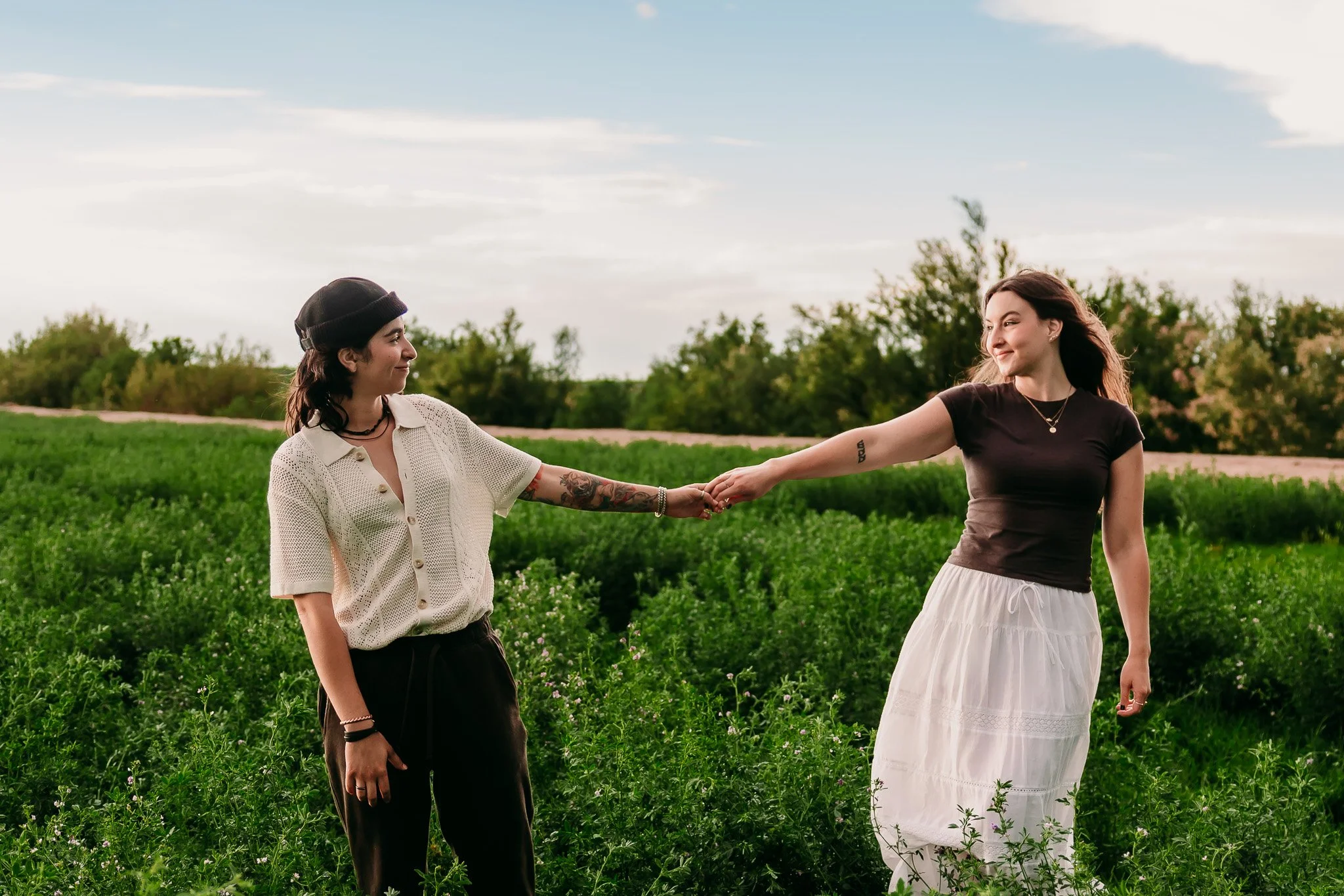 Couple sharing a joyful embrace during a sunset couples session in Mesilla, New Mexico. Inclusive photography.