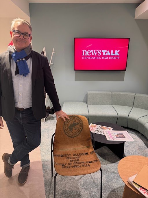 Robert Trench in the News Talk Studio with a chair made of Hemp
