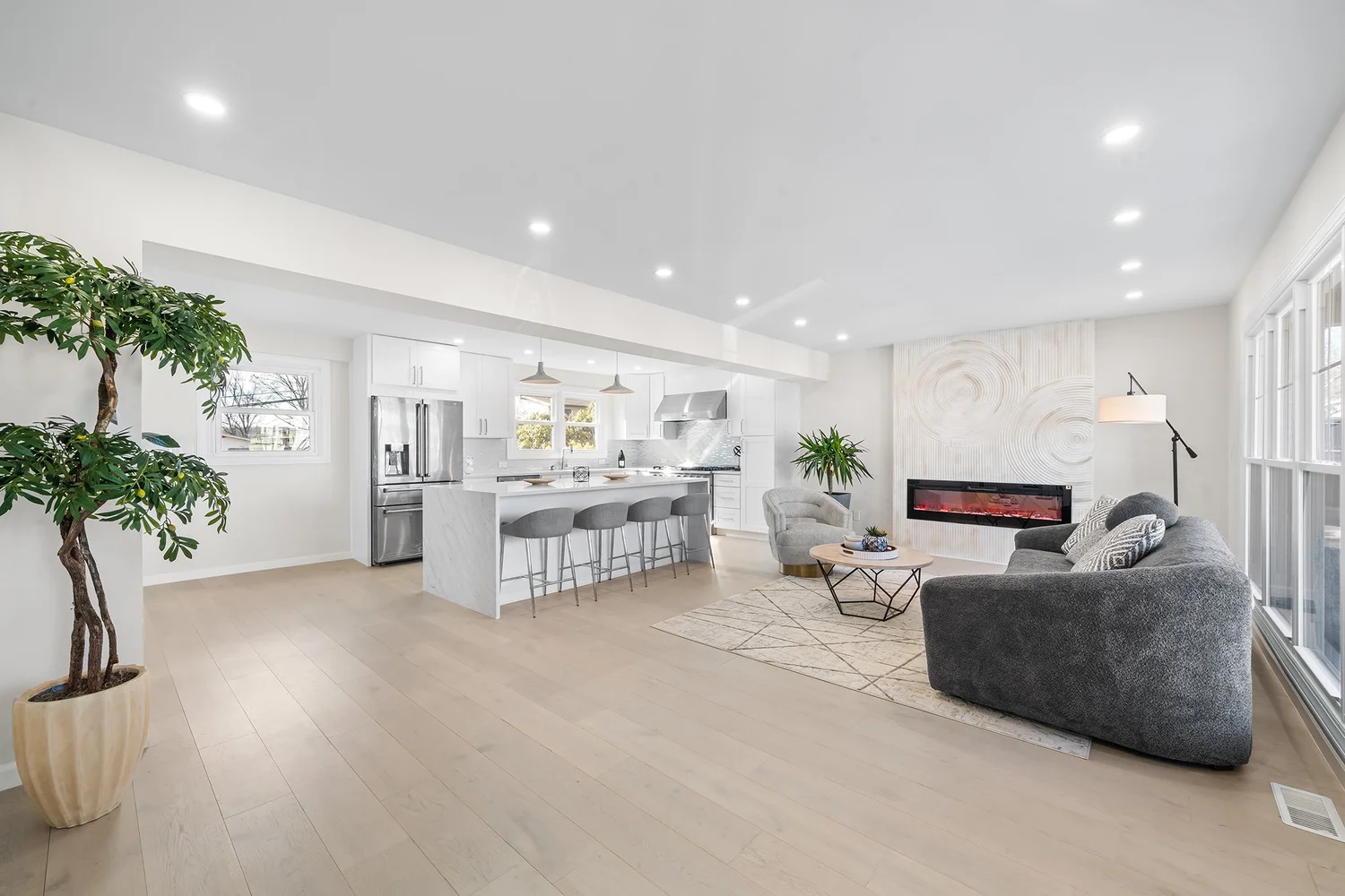 Whole-home remodel open living area with kitchen and island