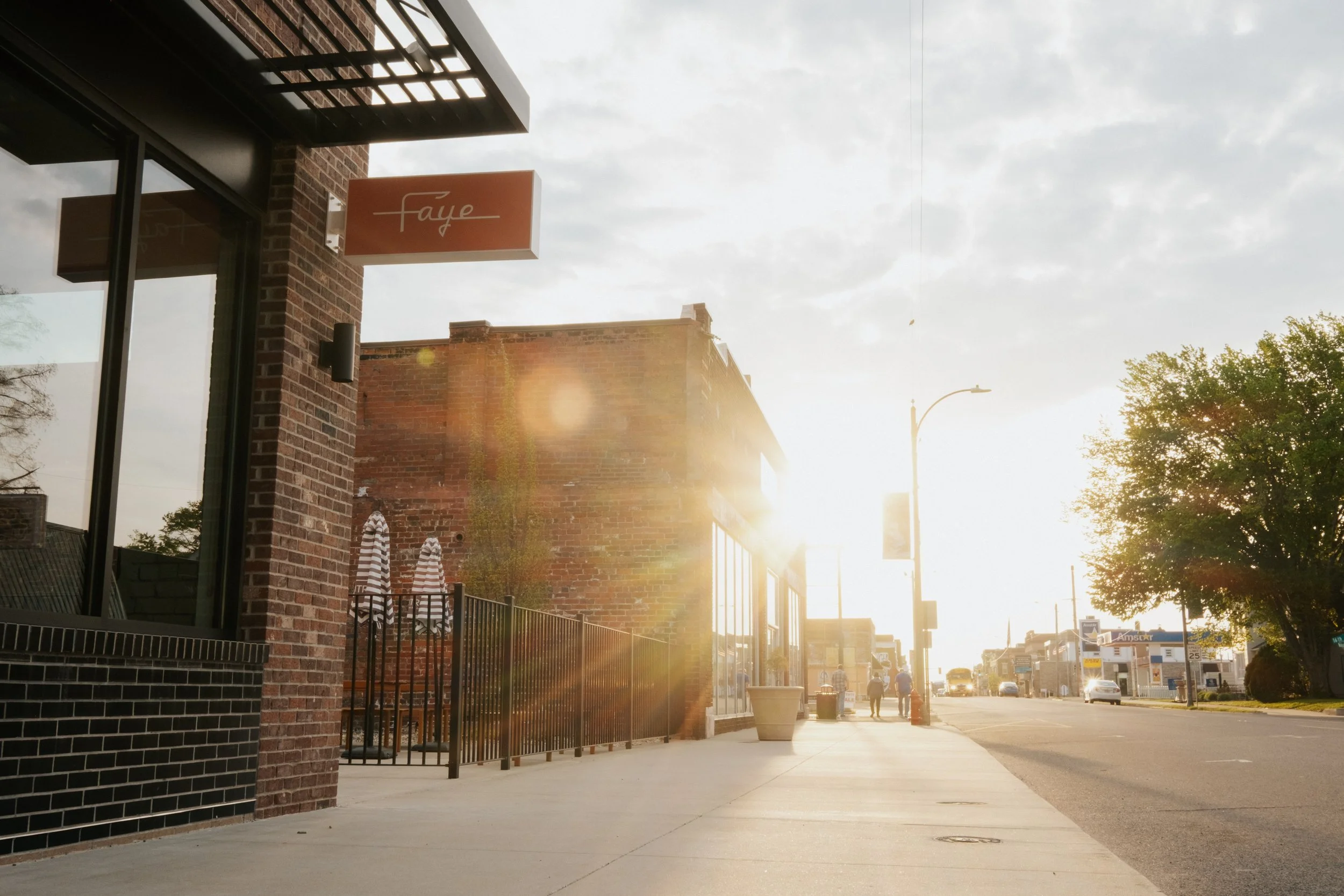 The sun rises on Walnut Street as Faye gets ready to open, April 10