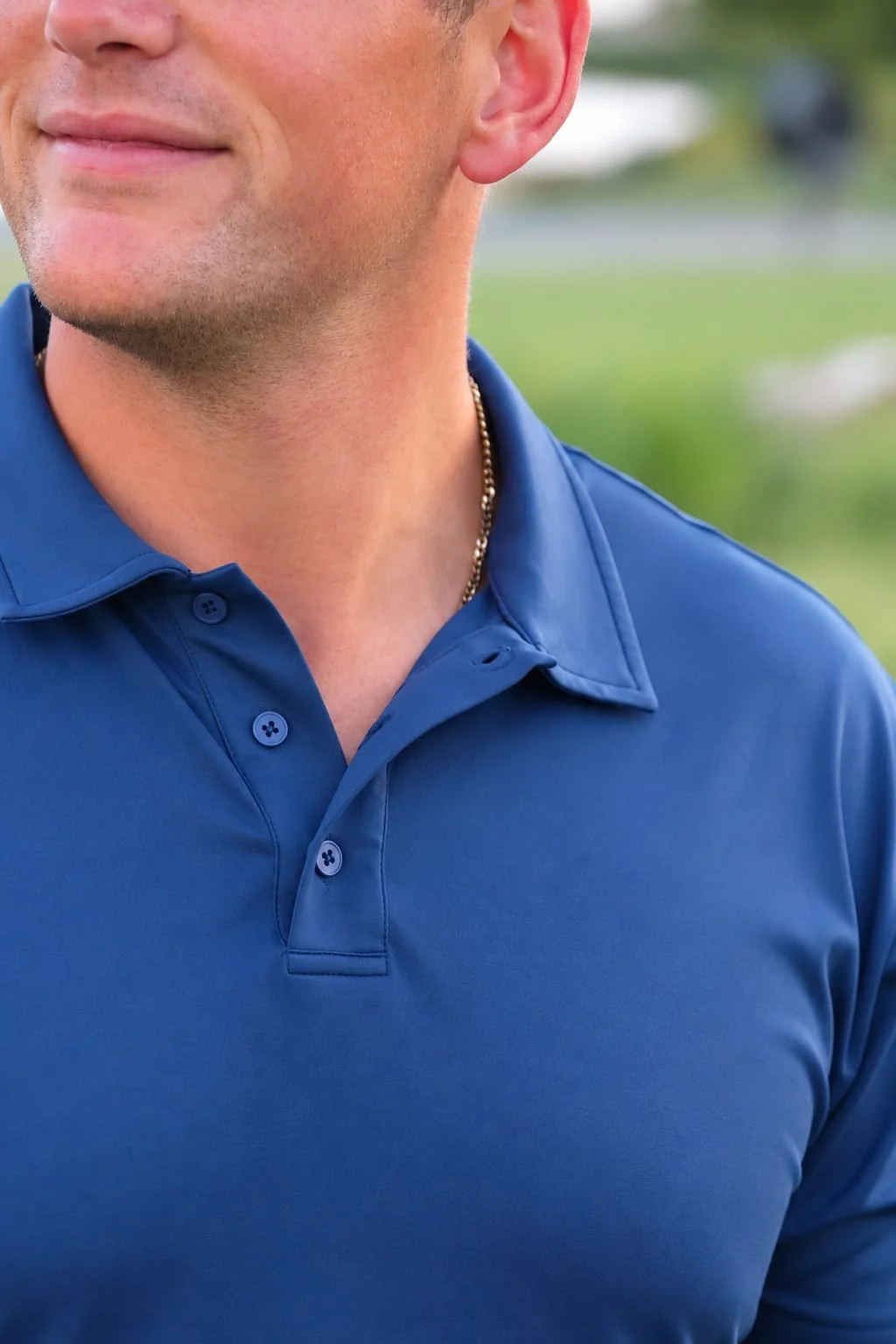 Close-up of the collar and button placket on The Classic polo in navy