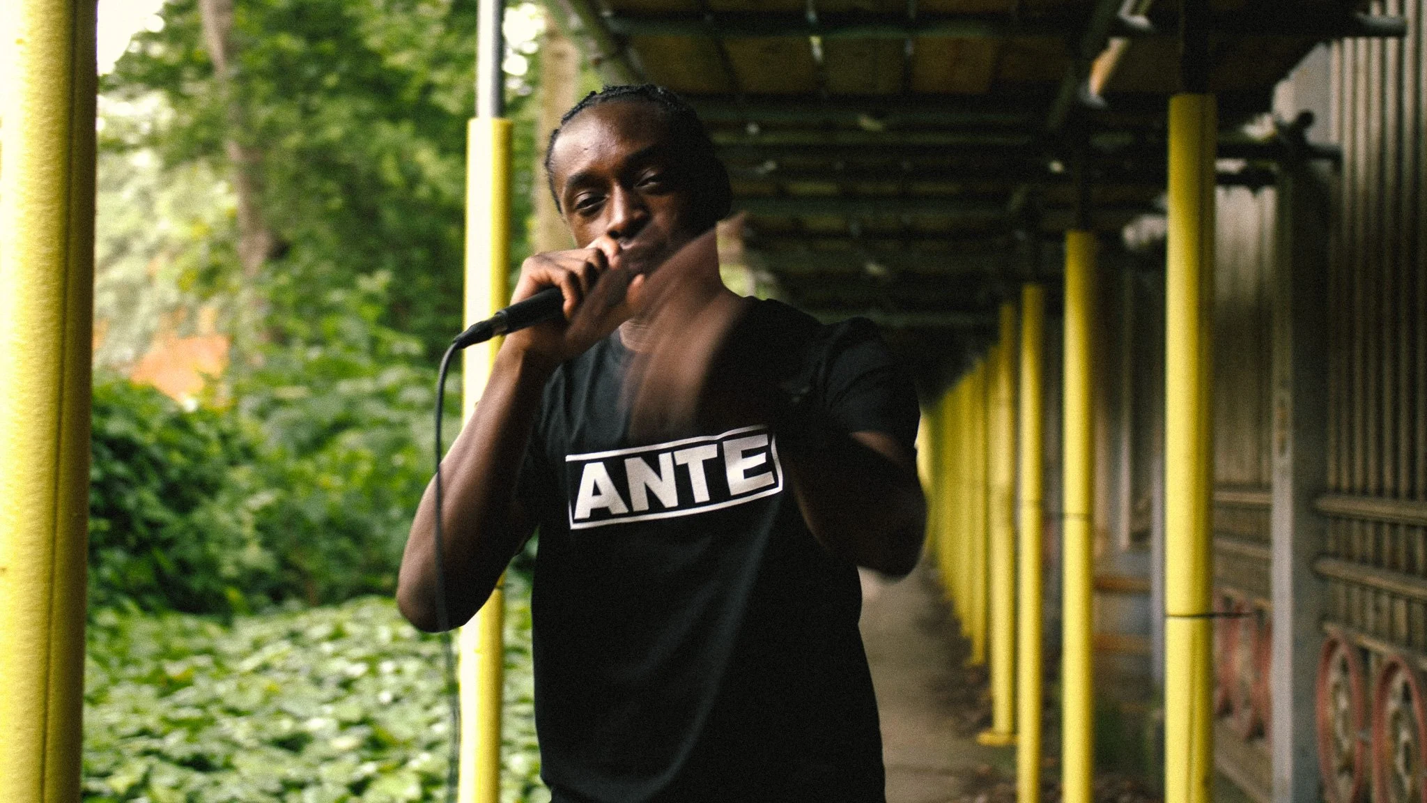Music video production in Manchester featuring an artist performing outdoors, filmed by Visually Allusive.
