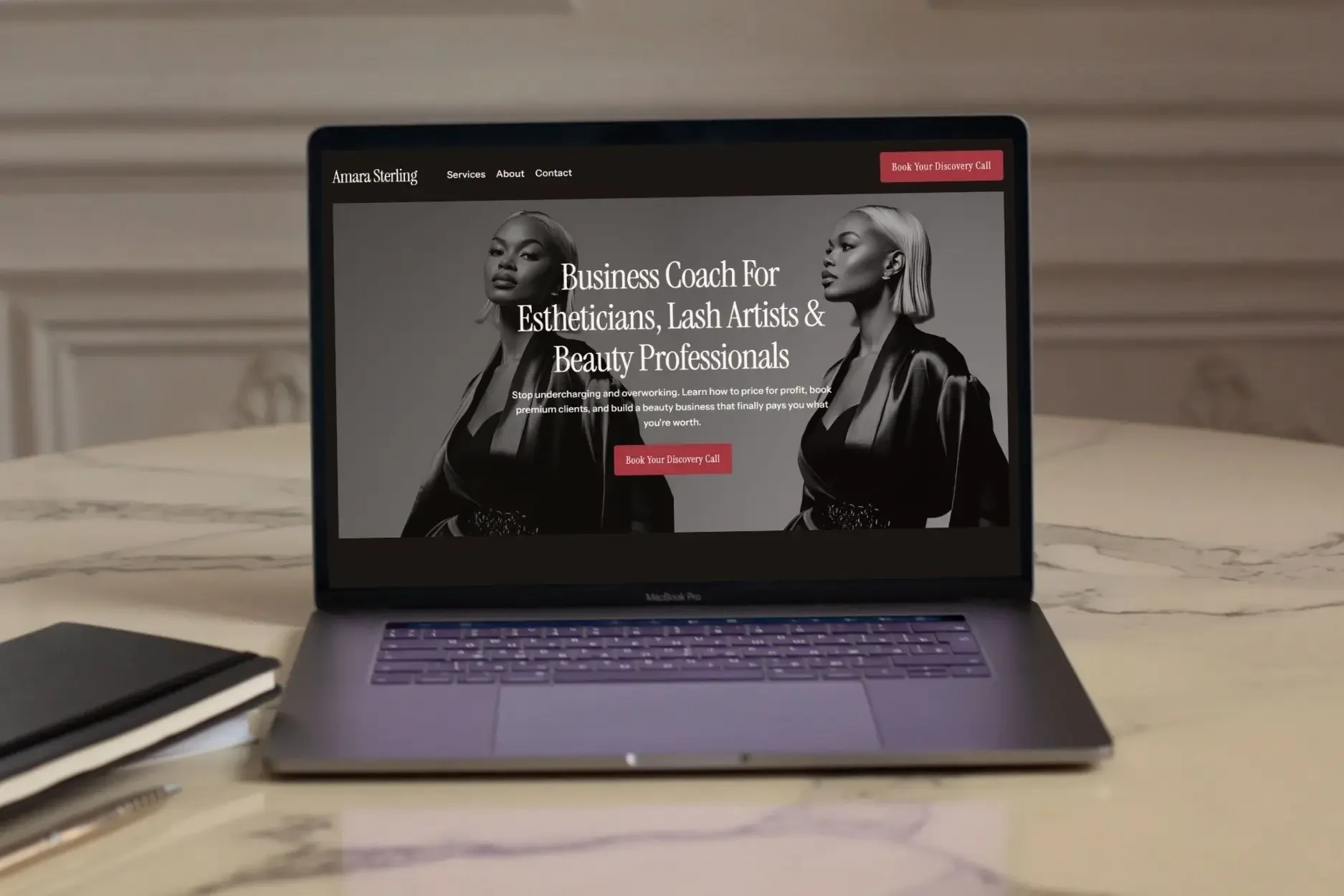 A laptop on a marble desk displaying a professional website, demonstrating website design help for small businesses.