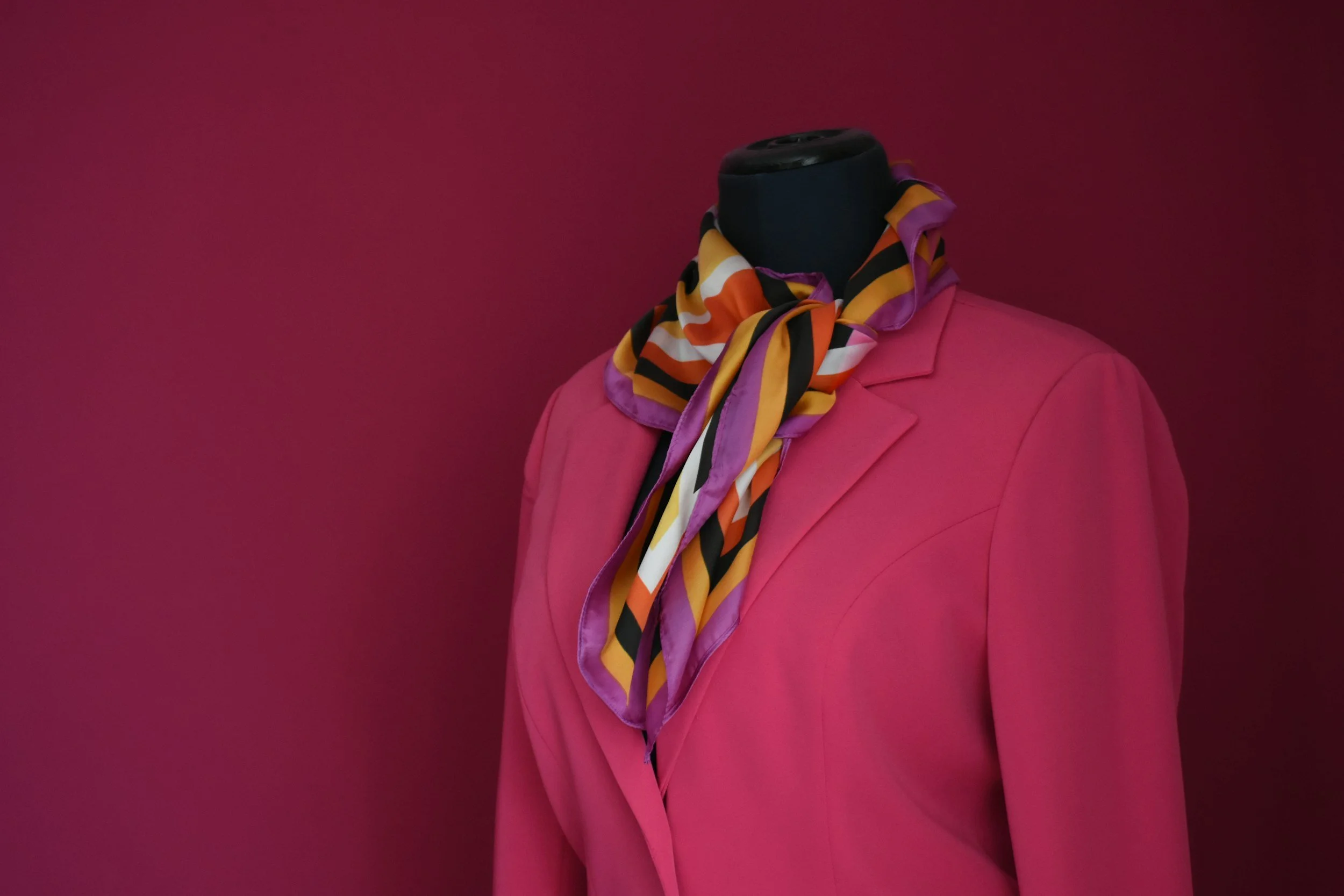 The Paradox of Strength: The Woman in the Pink Suit