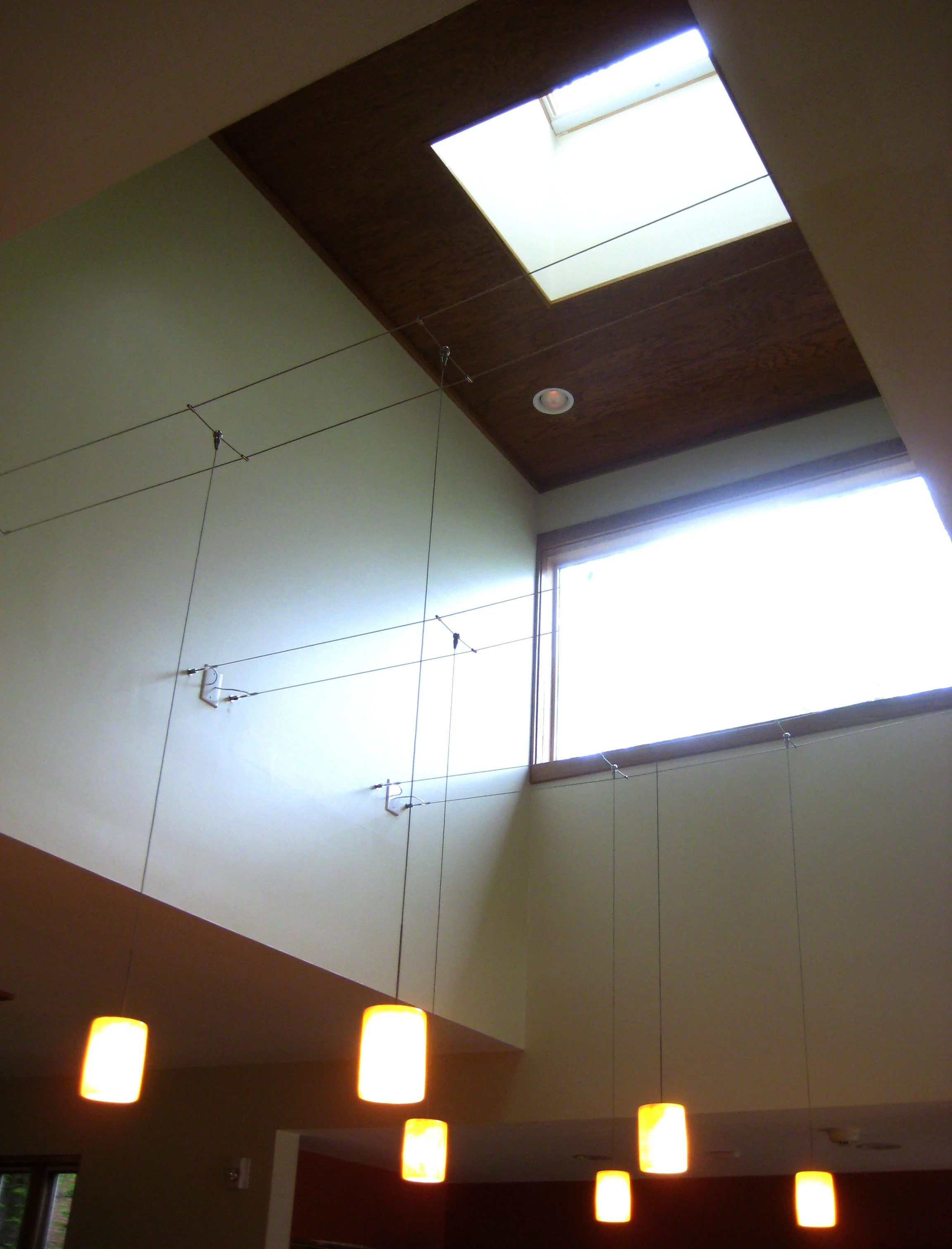 Lightwell House by AsOne Architecture featuring skylights that bring natural daylight deep into the home, inspired by shafts of light through the forest canopy.