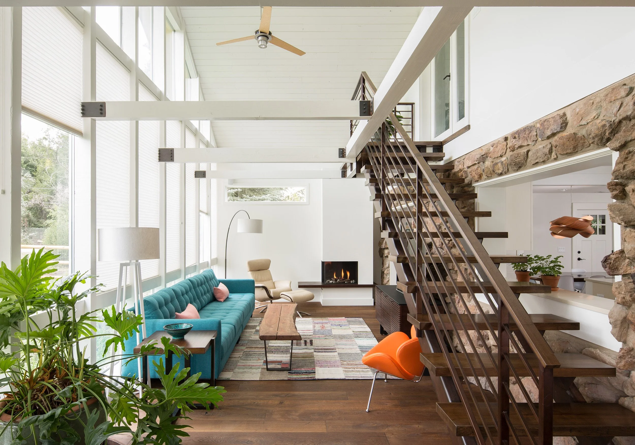 The renovated Anabranch House opens the original stone home into a light-filled living space connected by a floating steel stair and continuous circulation.