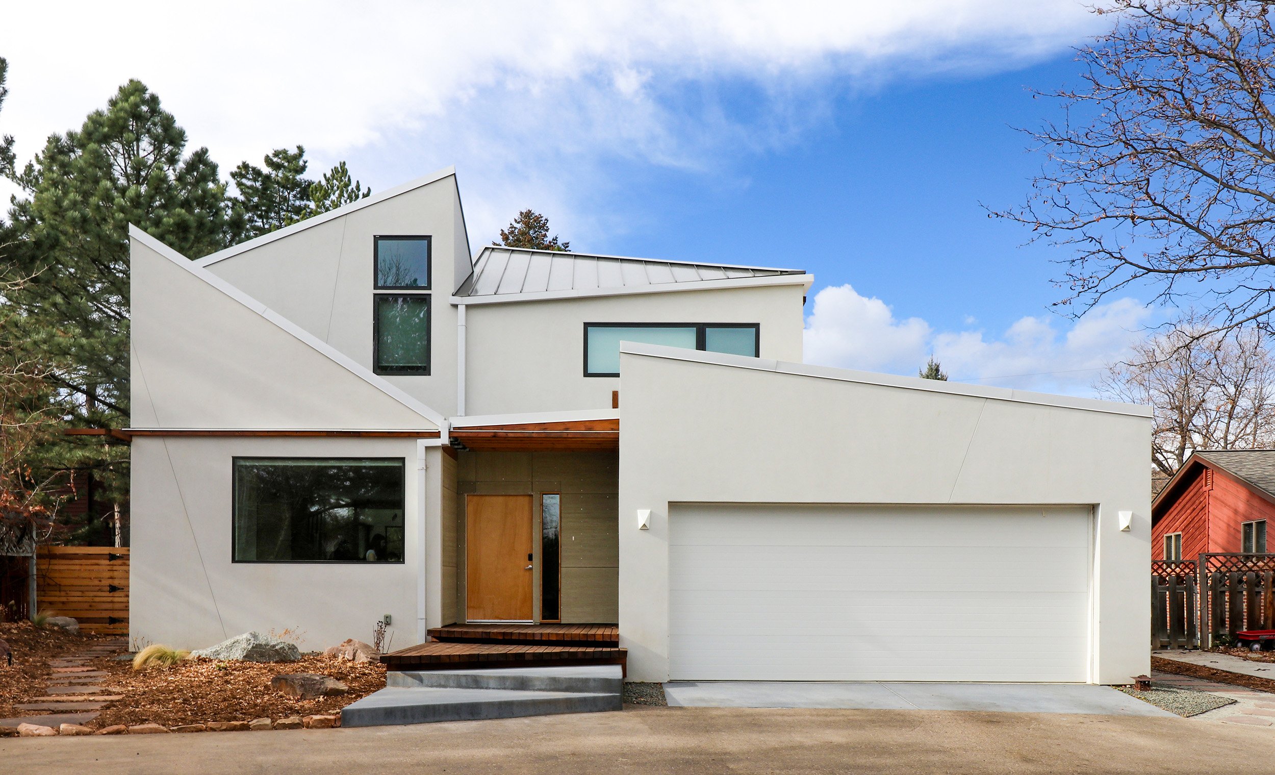 Front facade of the Tectonic House, a custom modern home in Boulder, Colorado shaped by the Quiet Phenomena of tectonic movement and mountain-inspired architecture.