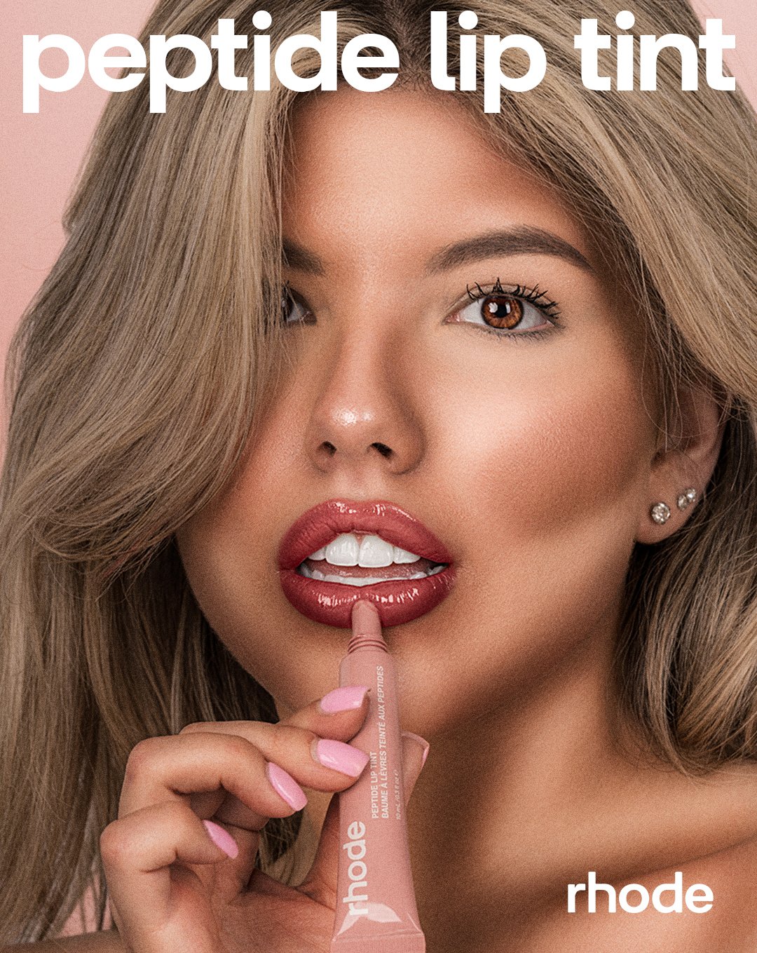 Professional beauty photography featuring a model with a glossy lip tint for a conceptual Rhode brand campaign in Tampa.