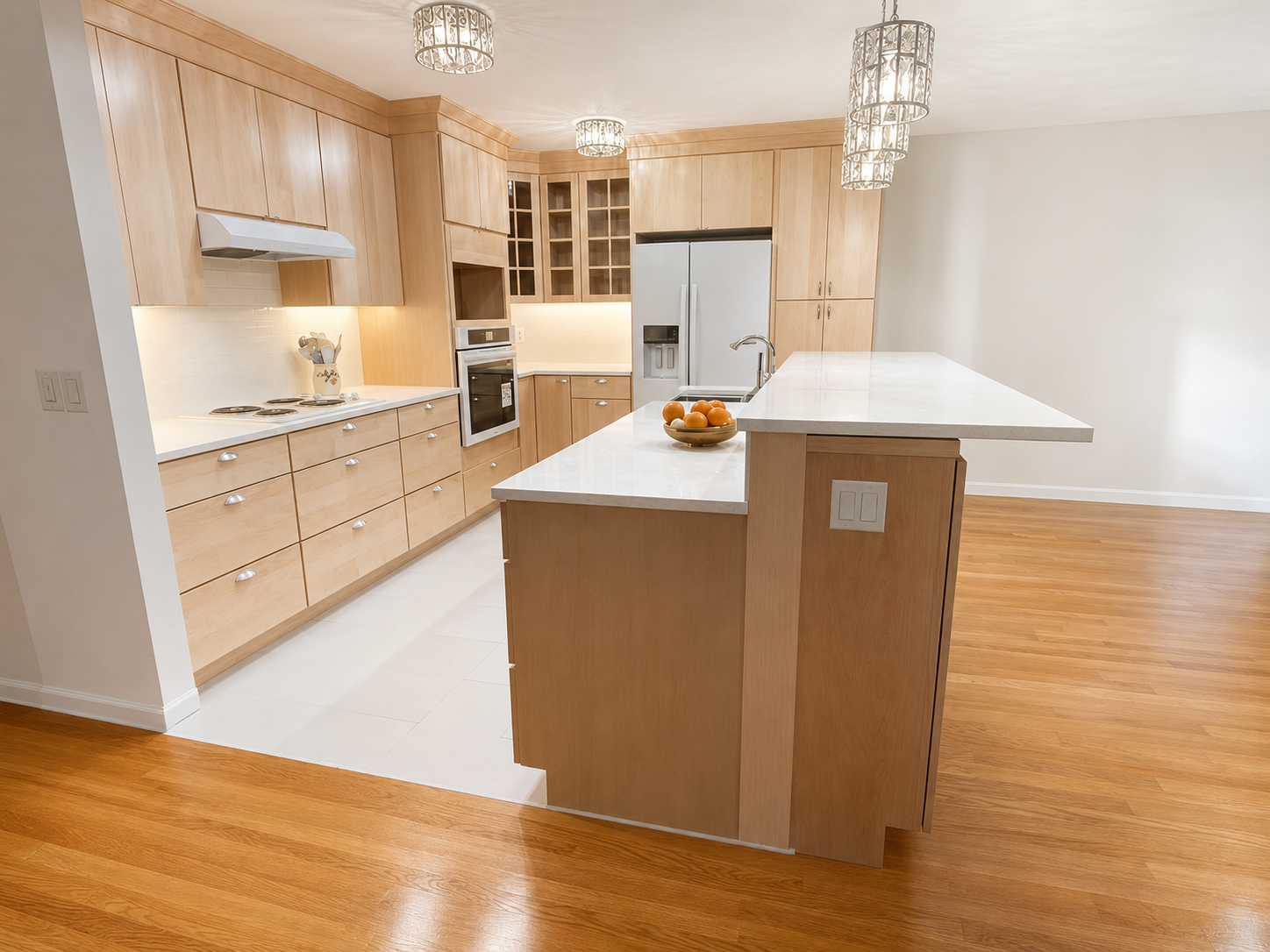 maple custom cabinets, cook top with drawer base below, wall oven, bar height counter top