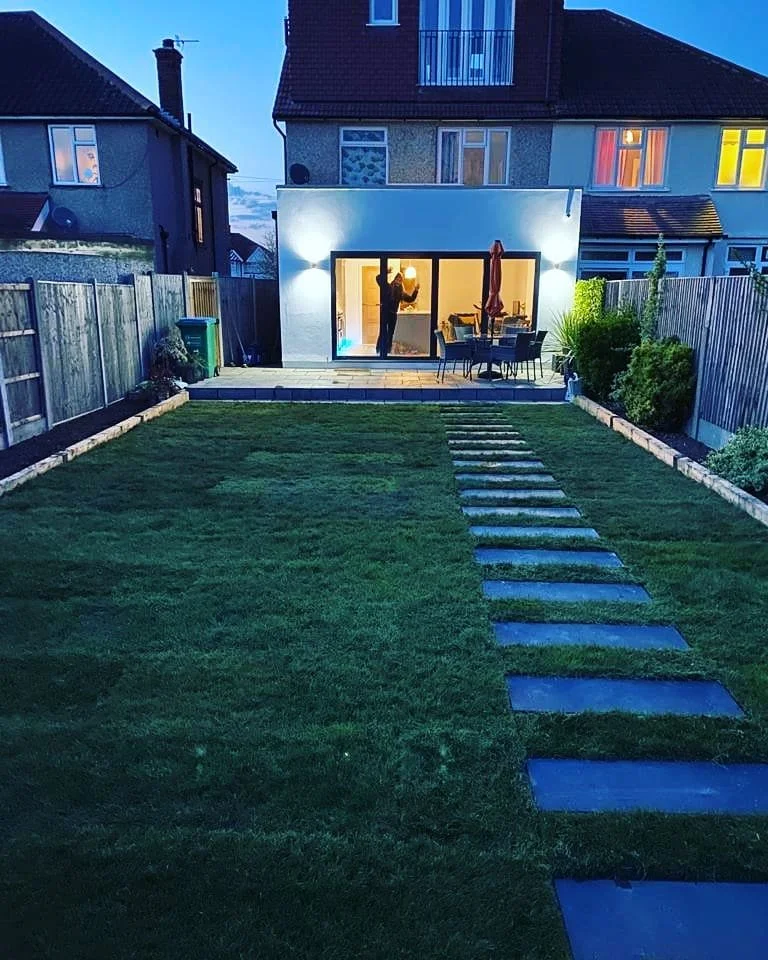 Garden raised with new Lawn and stepping stones to the back patio! Another happy customer!