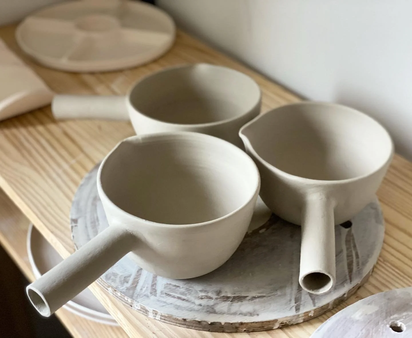 It was a late one last night..
Had to get the handles attached while the pieces were leather hard.

When it comes to pieces with parts to attach timing is key as it cannot be too hard or too soft, too dry or too wet.

A custom creation for a tea hous