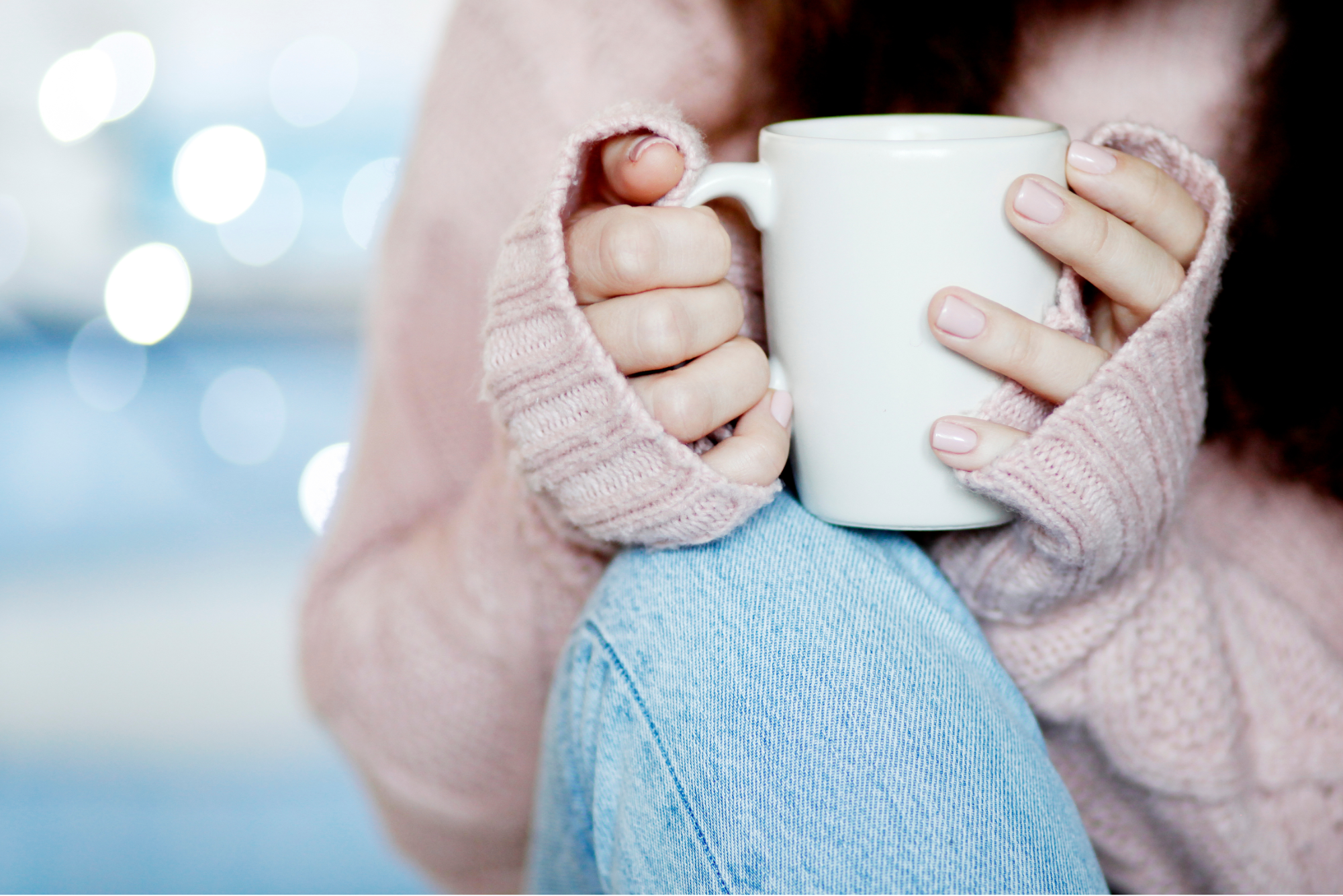 A woman holding a cup