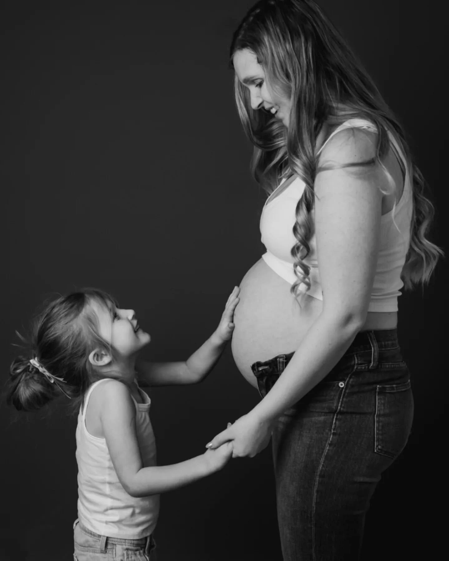 Mothering while pregnant hits differently. 

It's bittersweet. 

You hold the child who made you a mother 
while growing the one who will change your family 
again.

There&rsquo;s excitement for what&rsquo;s coming.
Tender moments with the child who 