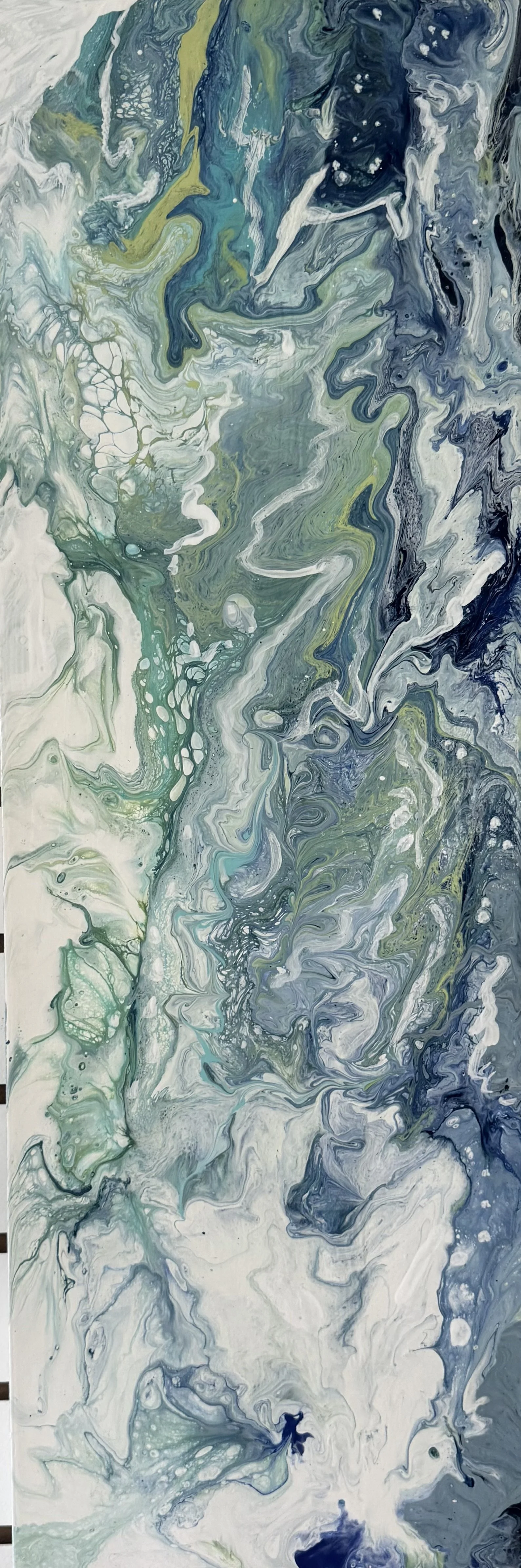 Abstract fluid acrylic painting with swirling patterns in shades of blue, green, white, and hints of yellow.