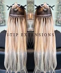 Two hair extension extensions with long blonde hair hanging down, labeled 'I-TIP EXTENSIONS'.