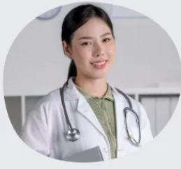 Young female doctor smiling with stethoscope in a clinical setting