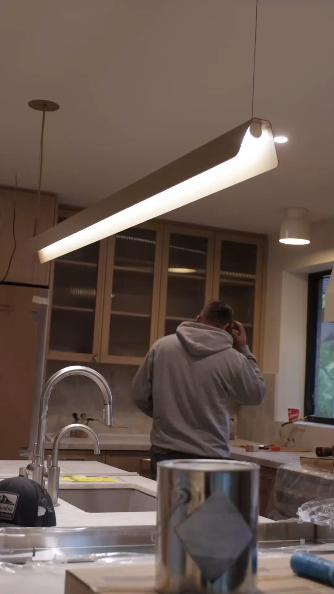 Precision Electrical Details in Luxury Kitchen Remodeling: Clean Stone Backsplash Receptacle Integration