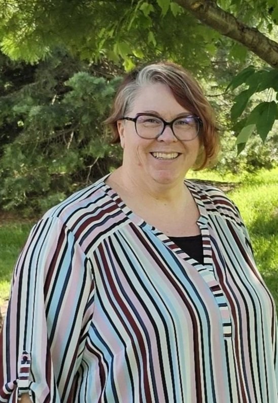 Mental Health Therapist Kris Clark under tree