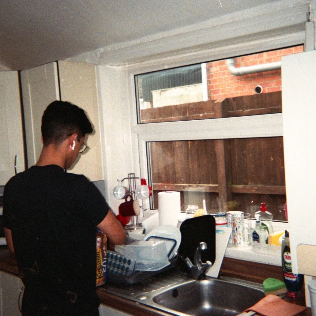 As a photographer, a lot of the hard work happens behind the scenes, and not just in the studio.

This photo takes me back to 2024. One of my (still close) Uni friends washing the dishes in our old house. It wasn&rsquo;t much, but it was ours. We wor