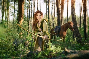 woman+hunting+archery+forest.webp