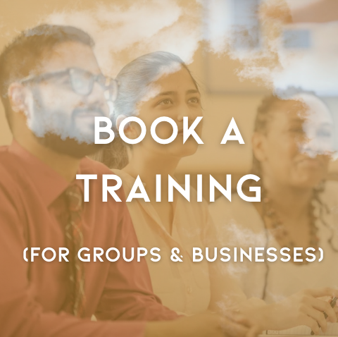 Text overlay on a photo of a training session with diverse participants, reading 'Book a Training for Groups & Businesses'.
