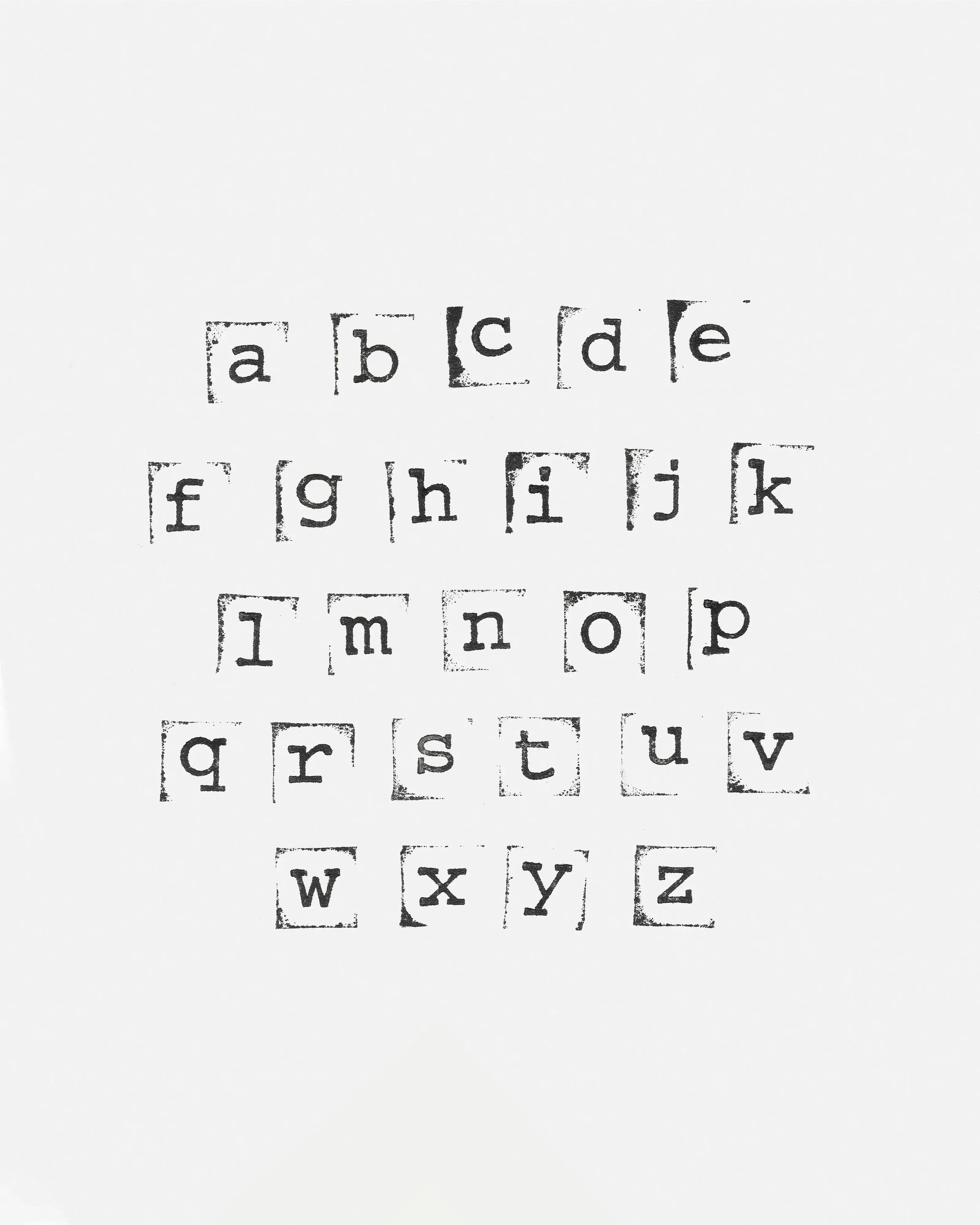 Black stamped alphabet letters from a to z on white paper in five rows.