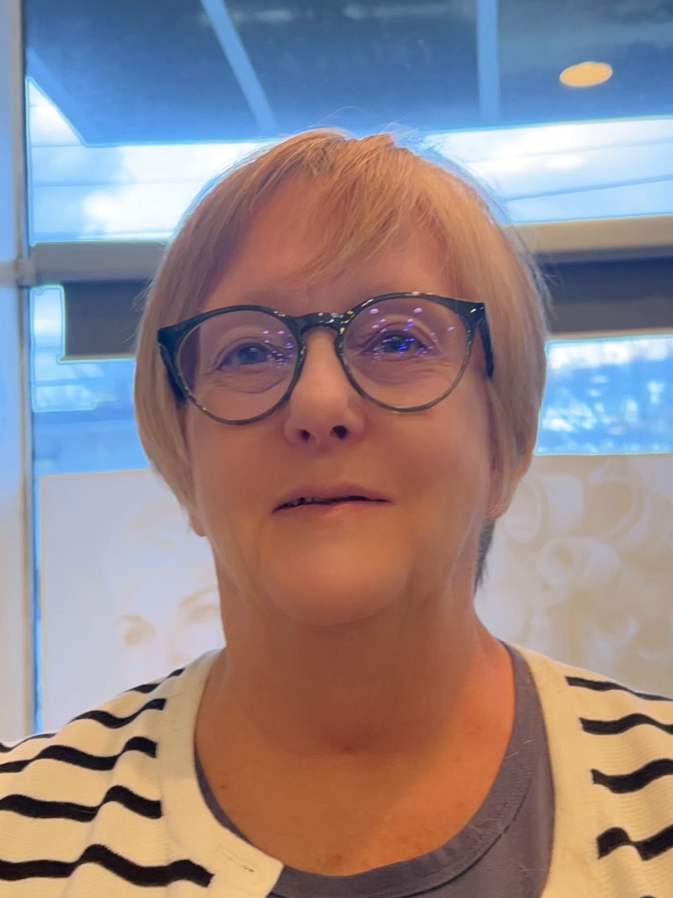 A generic placeholder image representing a person silhouette against a gray background.