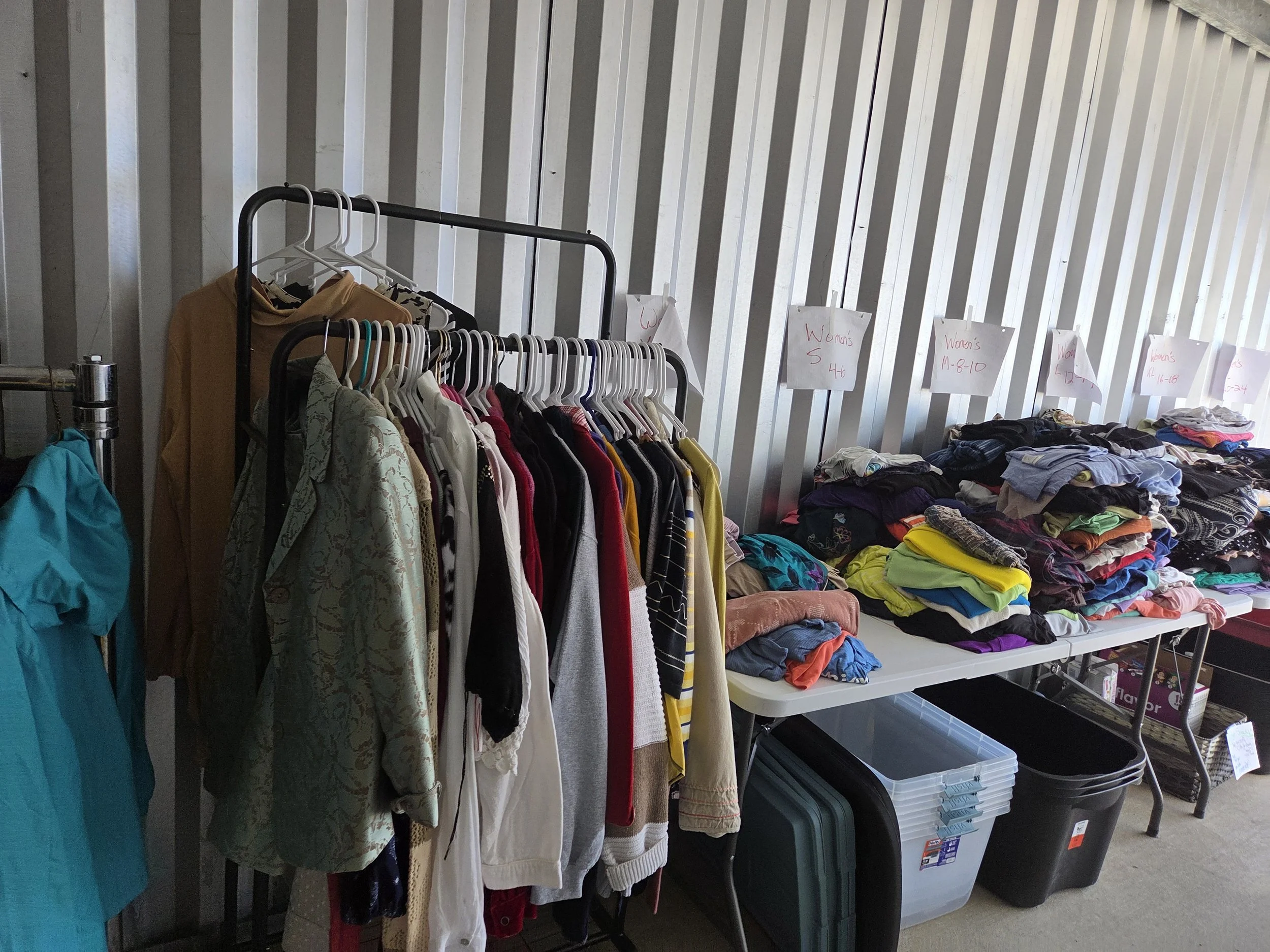 Organized clothing and essential items for Free Westmoreland community support.