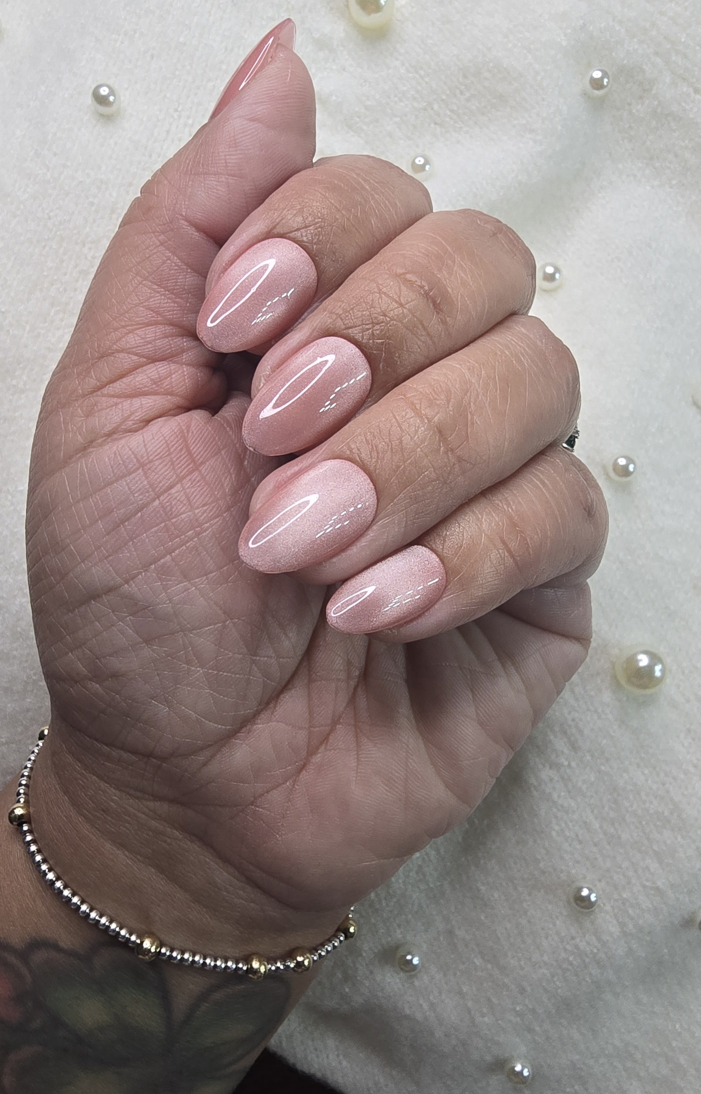light-pink-cateye-short-almond-nails