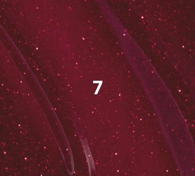 Number 7 on a dark red, starry background with abstract streaks of light.