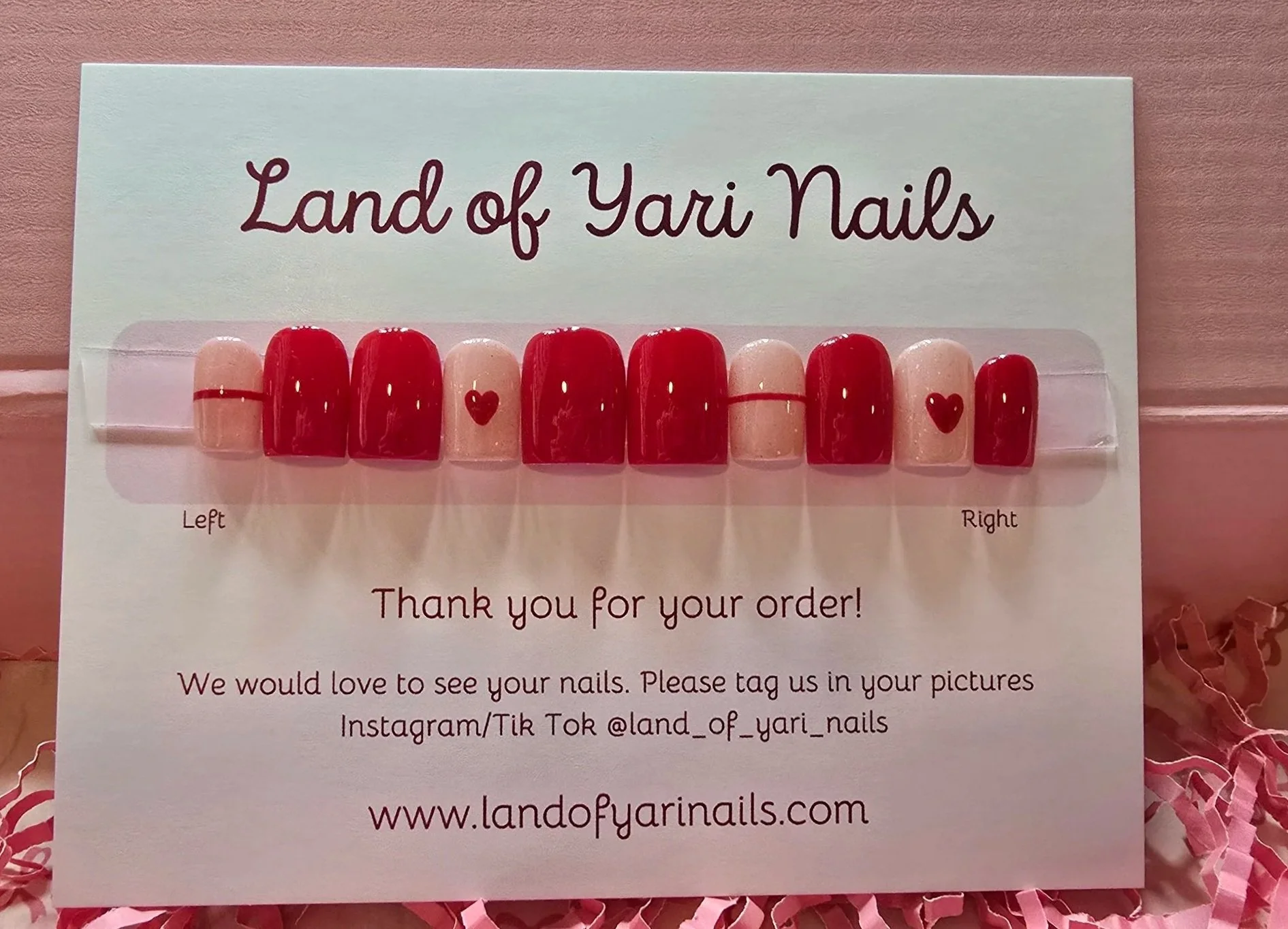 red-extra-short-nails-with-nude-base-and-horizontal-line-accents-and-nude-base-with-hand-drawn-heart-accents