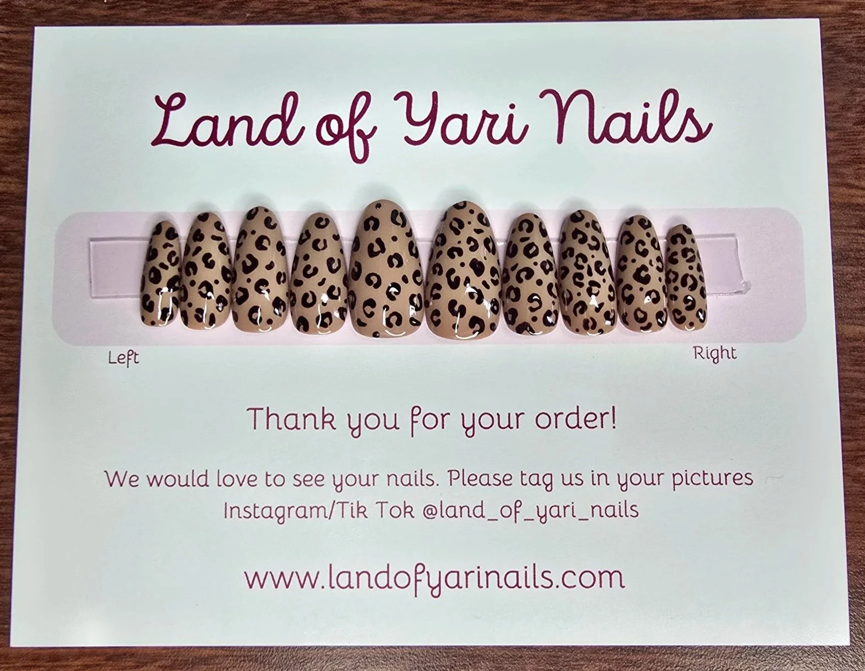 light-brown-base-nails-with-black-leopard-dots-medium-round