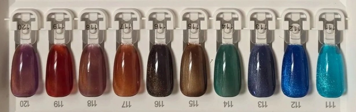 A color palette of 10 nail polish samples arranged in a row, labeled with shades 120 through 111 on the bottom and numbers 20, 19, 18, 17, 16, 15, 14, 13, 12, and 11 on top. The shades range from purple, red, bronze, black, brown, green, dark blue, bright blue, to turquoise.