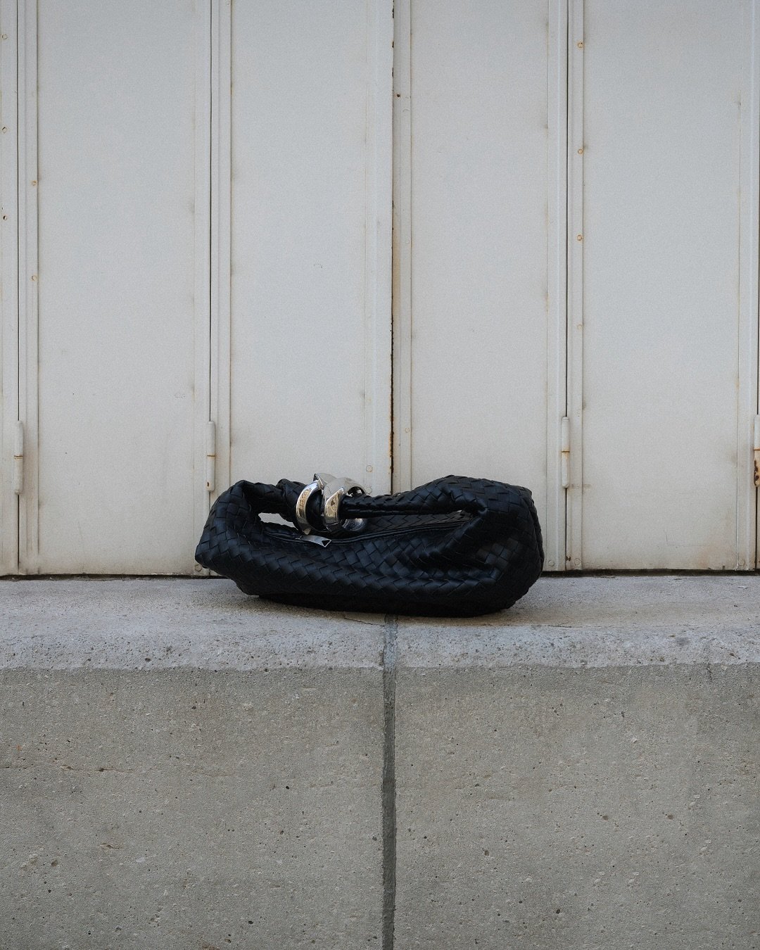 All black with a touch of silver while carrying my @newbottega around #PFW. Who&rsquo;s in town and wants to grab a coffee? 

__
@meller sunglasses 
@thefrankieshop black oversized blazer 
@bytominaga pleated wide black trousers 
@zara kitten heeled 