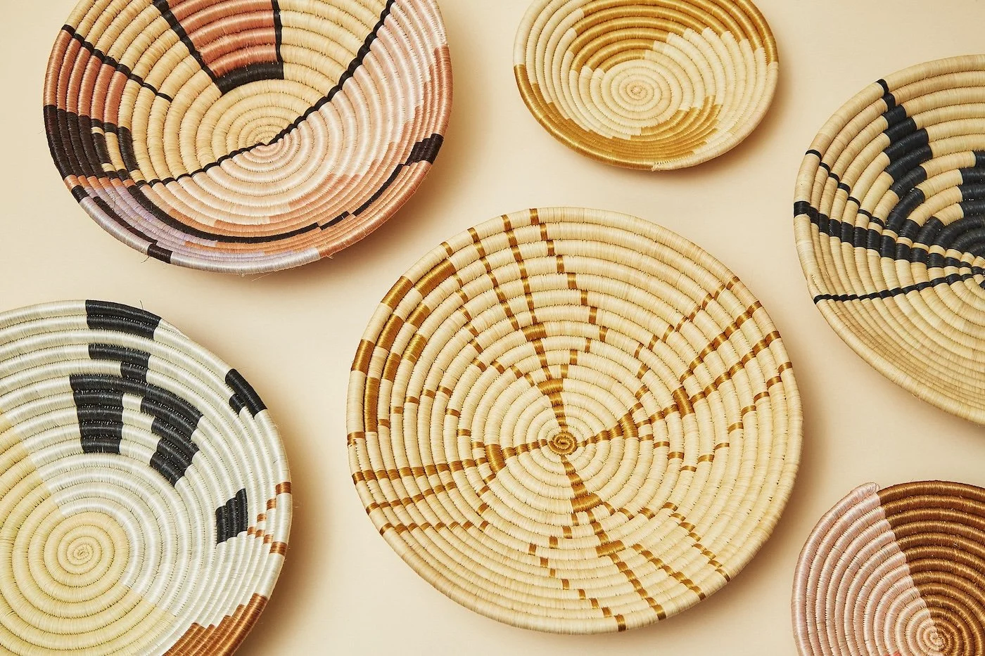 Klaviyo Email & SMS Marketing Service - A collection of woven baskets in various shapes and sizes with colorful patterns on a light background.