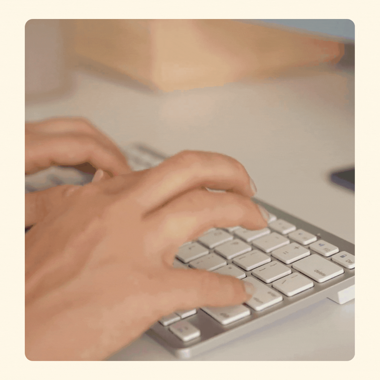 A gif of hands typing on a silver laptop keyboard with a blurred background and then transitioning to the view of an email being adjusted manually in the Figma design software.