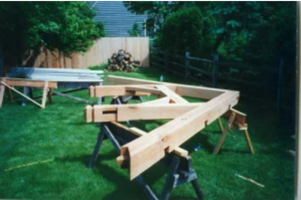 TimberFrame addition with Hammerbeam Bents and Curved Knee Braces.2.png