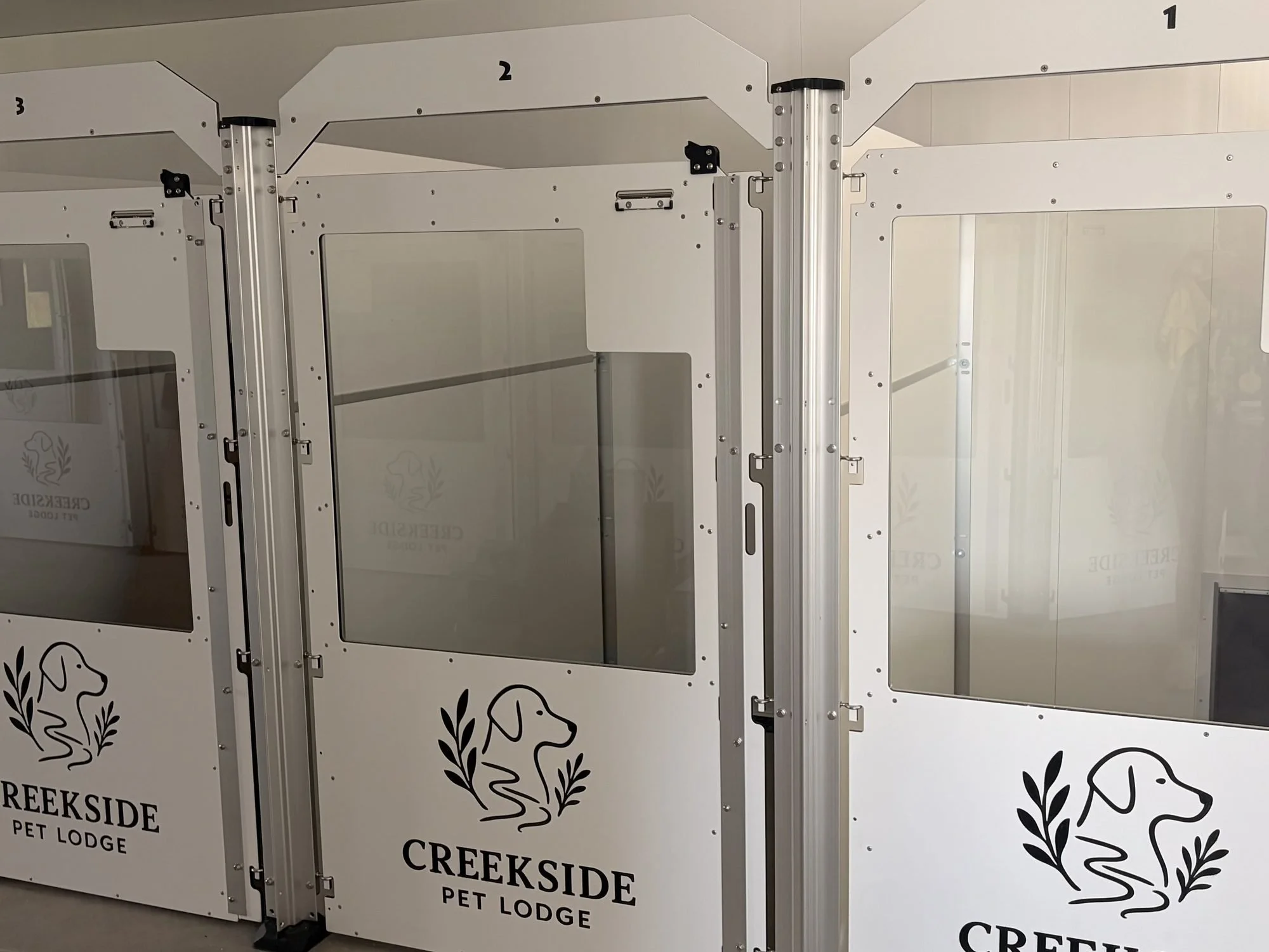 Private indoor/outdoor dog runs at Creekside Pet Lodge