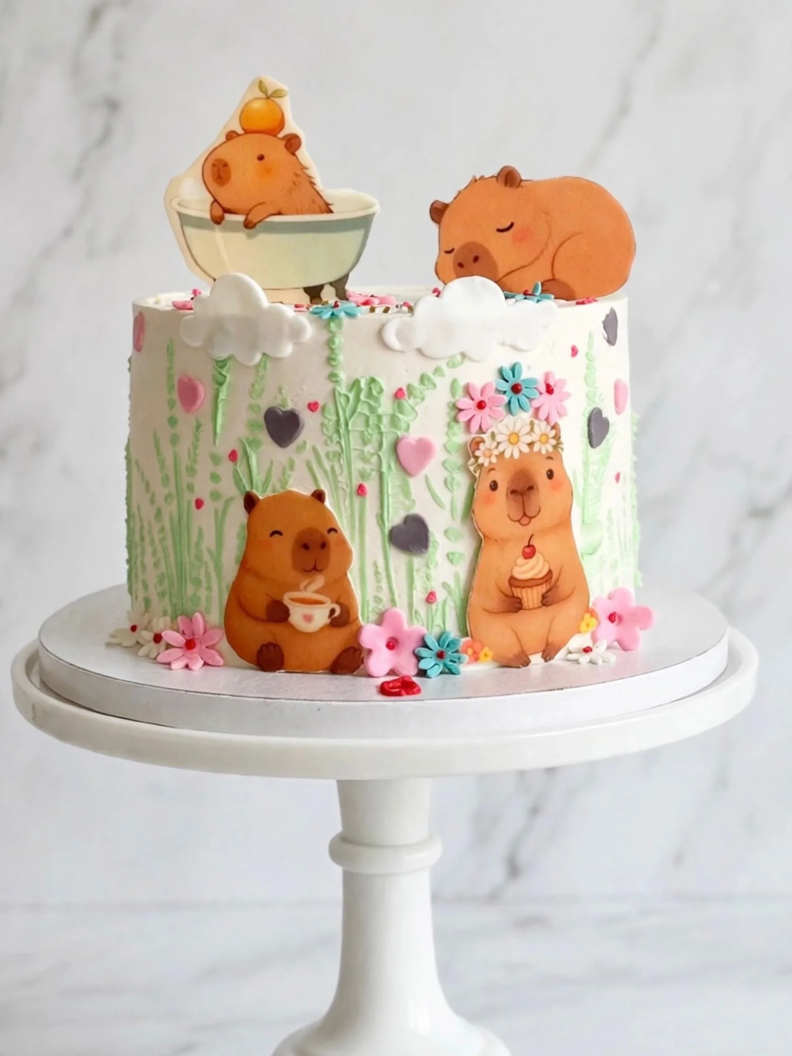 I learnt from this cake request that Capybaras are trending in the world of kids these days! The cutest Capybara Cake 🥹💐
 

The classic combination of chocolate covered strawberries turned into cake!
#
Hand-piped grass, fondant clouds &amp; flowers